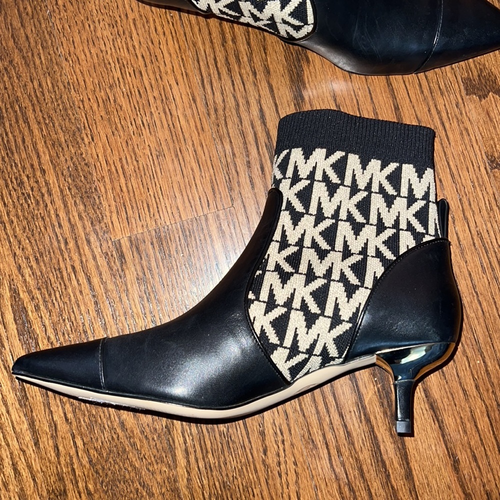 Michael Kors Shiloh Stretched logo leather boots.